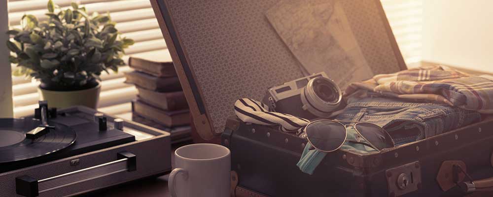 An open suitcase with neatly packed clothes and essentials, ready for a trip.