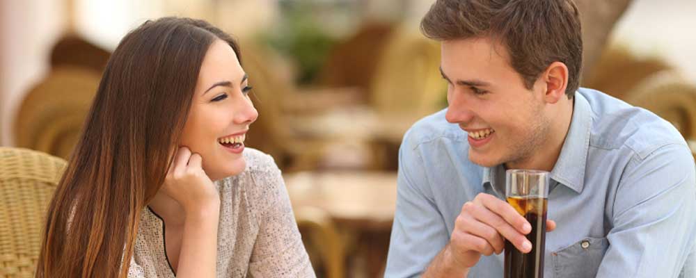 Couple on a date night, dressed up and looking confident, preparing to enjoy a fun evening out